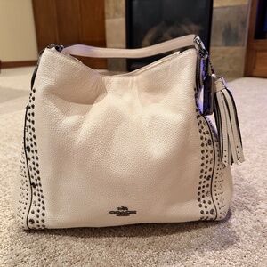 Leather Coach purse with a little flair